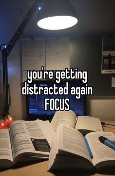 an open book with the words you're getting distracted again focus