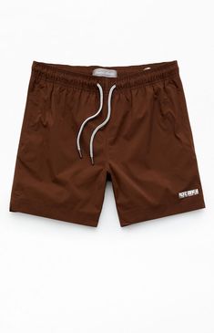 The PacSun Solid Ripstop 6.5" Swim Trunks are designed to carry you through the summer with their durable construction. Featuring a drawcord waistline for a comfortable fit, side pockets, a logo detail at the hem, and a practical full mesh lining. They also include a single back pocket equipped with a drainage hole for added functionality. Ideal for enjoying both style and functionality at the beach or poolside.Drawstring waistlineSide pocketsSingle back pocket with drainage holeFull mesh lining6.5" Inseam17" OutseamLogo at the hem100% PolyesterMachine washable PacSun Mens Solid Ripstop 6.5" Swim Trunks - Brown size Small Swim Trunks With Built-in Shorts Relaxed Fit, Summer Swim Trunks, Short Length, Casual 4-way Stretch Swim Trunks, 4-way Stretch Nylon Swim Trunks, Micro-elastic Solid Swim Trunks, Pacsun Mens, Swim Trunks, Pacsun, Swim Shorts