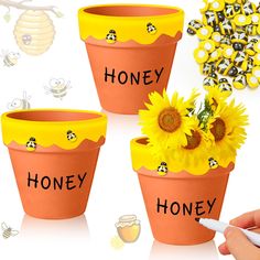 three flower pots with bees and sunflowers on them, one has honey written on it