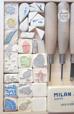 a box filled with lots of different types of stamping and cutters next to each other