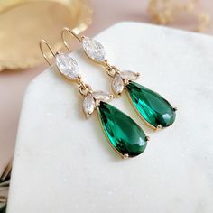 Handmade Jewelry Designed and Handmade to order in USA. Gold Emerald Green Earrings for brides, weddings and bridal showers. The perfect gift earrings for bridesmaids, mother of the groom, or mother of the bride. Find earrings for bridal bachelorette party or other special occasions here. A gentle cascade of shimmering Clear and Emerald Green crystals in these beautiful nature-inspired bridal earrings. Adding just a hint of sparkle, this pretty pair make gorgeous earrings for both brides and bri Earrings For Bridesmaids, Green Statement Earrings, Earrings For Bride, Emerald Green Earrings, Bridal Bachelorette Party, Long Dangle Earrings, Handmade Jewelry Designs, Earrings Green, Wedding Jewelry Earrings