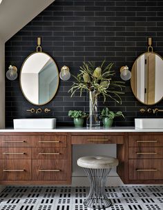 a bathroom with two sinks and three mirrors on the wall next to a tiled floor