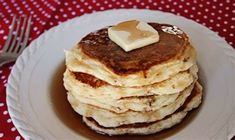 a stack of pancakes with butter on top