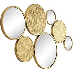 four mirrors are arranged in the shape of circles