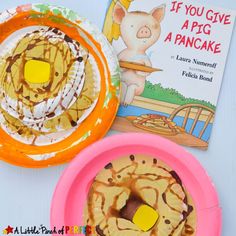 two plates with donuts on them next to a book about if you give a pig a pancake