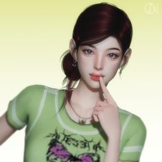 a woman in a green shirt is holding her finger to her lips