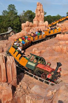 an amusement park ride with people riding on it