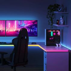 two computer monitors sitting next to each other in front of a desk with neon lights