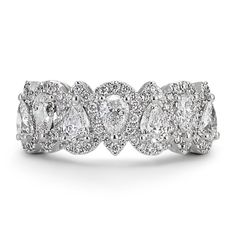 a wedding band with three pear shaped diamonds on the sides and two rows of smaller pears in the middle