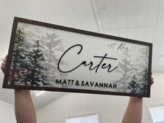 two hands holding up a sign that says cristet and matt & savannahh