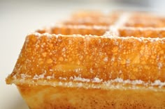 a close up view of some food with powdered sugar on top