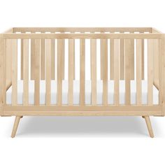 a small wooden crib with white sheets on the bottom and side rails, in front of a white background