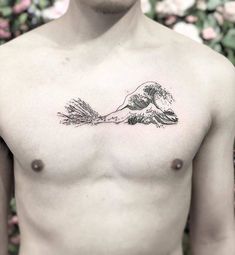 a man with a tattoo on his chest