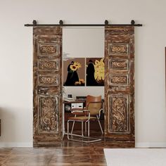 This antique carved wooden double door features exquisite floral carvings that add a touch of natural elegance and intricate craftsmanship. The sliding barn door design evokes rustic charm while maintaining a sophisticated, vintage appeal. The detailed floral patterns are delicately carved into the wood, offering a rich, textured look that brings warmth and character to any space. The sturdy, timeless design is perfect for a barn-style setting or as a unique architectural statement piece in mode Wooden Double Door, Carved Wood Doors, Wood Barn Doors, Sliding Closet Door, Wooden Double Doors, Rustic Eclectic, Carved Door, Wood Barn Door, Indian Doors