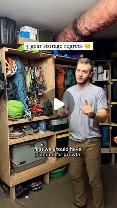 a man standing in front of a closet filled with items