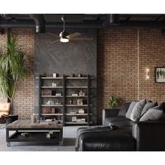 an industrial living room with brick walls and leather couches, coffee table, bookshelf and potted plant