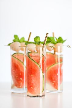 three glasses filled with watermelon and mint garnish