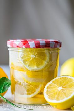 a jar filled with lemonade and sliced lemons