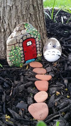 an image of a rock garden with a house on it