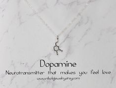 "Small Silver Dopamine Molecule Necklace. I use the most gorgeous high-quality sparkly sterling silver chain which makes this necklace as one reviewer says \"absolutely stunning.\" Keep this in mind when comparing similar products. Dopamine is a modern symbol of love and desire. Dopamine molecules interact with receptors in the brain to induce feelings of love, attention, and excitement. Dopamine also has an elegant shape. As a necklace, it is an attention-grabber. Perfect for the chemistry or b Dna Ring, Chemistry Necklace, Biology Jewelry, Dna Jewelry, Molecule Necklace, Honeycomb Necklace, Geek Jewelry, Necklace Extender, Love Symbols