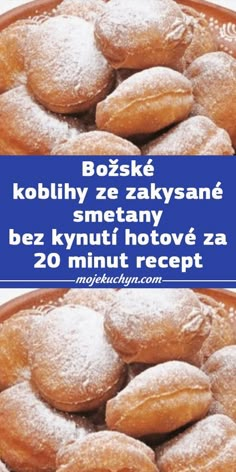 there is a bowl full of doughnuts with powdered sugar on top and the words booskie kohlhy ze za