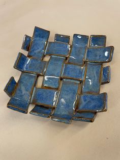 a group of blue dishes sitting on top of a white countertop next to each other