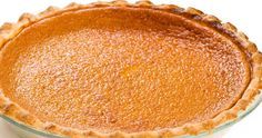 a pie crust in a glass dish on a white background