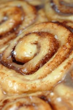 cinnamon rolls with icing in a pan ready to be baked