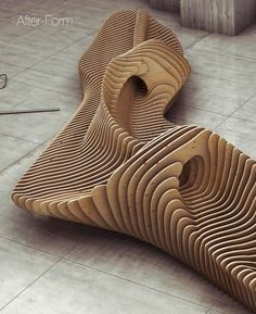 two wooden benches sitting on top of a floor next to each other in a room