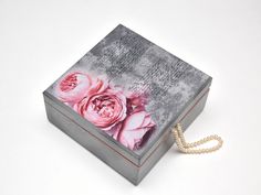 a box with pink flowers painted on it