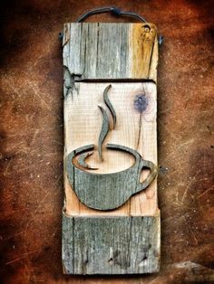 a wooden sign with a cup of coffee on it