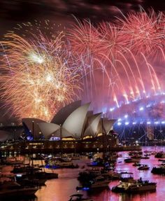 fireworks are lit up over the sydney harbour during new year's eve celebrations in australia