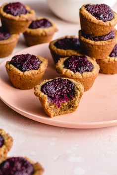 several small muffins on a pink plate