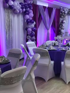 a purple and silver themed party with balloons, chairs, table cloths and decorations