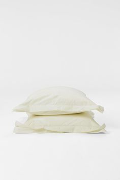 three pillows stacked on top of each other