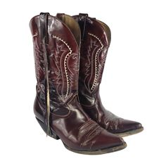 Vintage Cowboy Boots by D'Jesus are a striking addition to your wardrobe, handcrafted in Mexico with oxblood red leather and intricate detailing. These Western-style boots feature pointed toes and a mid-calf shaft, making them perfect for a variety of occasions from casual outings to parties. The thick stitching, and exotic skin accents add a touch of authenticity and style to these unique boots. Step out in true cowboy fashion with these one-of-a-kind boots that exude a blend of Mexican, Wester Cowboy Leather Boots, Exotic Cowboy Boots Men, Old Cowboy Boots, Cowboy Boots Vintage, Cowboy Fashion, Thick Stitching, Cowboy Vintage, Red Cowboy Boots, Cowboy Shoes