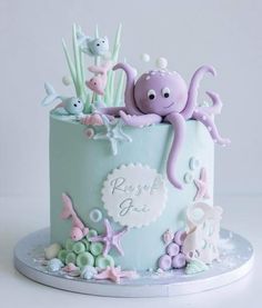 a cake decorated with an octopus and sea creatures