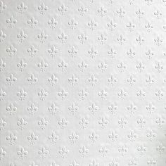 a white wallpaper with fleur de lis on it and a vase filled with flowers