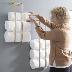 Keep your bath towels clean, neat, and accessible with this set of two towel racks. They are made from iron in your choice of a neutral hue and have an industrial look that is urban and on-trend. We love the open, innovative design that accommodates every size of a rolled towel - from oversize bath towels to hand towels - and keeps your closets and cabinets free for bathroom essentials and cleaning supplies. This set includes a large and a small rack and comes with mounting hardware. Finish: Gol Towel Organization Bathroom, Small Rack, Rolled Towels, Wall Towel Racks, Mounted Towel Rack, Metal Bathroom, How To Roll Towels