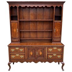 an old fashioned wooden dresser with drawers and cupboards on it's sides, isolated against a white background