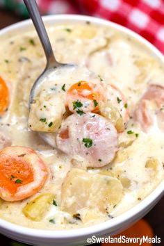 a close up of a bowl of soup with shrimp and dumplings