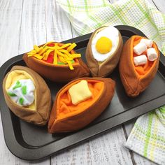 some kind of food that is on a tray with eggs and cheese in the middle