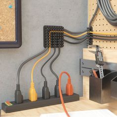 the electrical wires are connected to each other in this workbench with tools on it