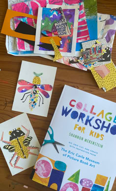 children's workbooks and craft materials laid out on a wooden table with scissors