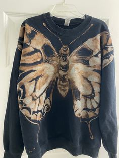 A whimsical, handmade, cotton blend sweatshirt with a one-of-a-kind moth design that has been carefully hand painted with bleach. Bleach Painting Idea, Bleach Sweater Design, Bleach Painted Sweatshirt, Painting On Sweatshirts, Bleach Painted Jacket, Hand Painted Ideas, Bleach Clothes Ideas, Art On Clothes Paint