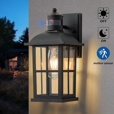 an outdoor light on the side of a building with motion sensor symbols and instructions below it