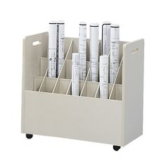 a white desk organizer filled with lots of papers and pens on wheels, in front of a white background