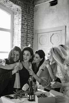 black and white photograph of women at a party