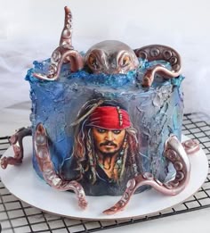 a cake decorated with an image of captain jack sparrow and octopuses on top of it