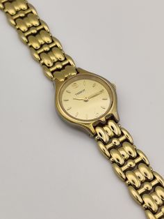 **AVAILABLE ON WWW.LAIA-AMANI.COM AT A LOWER PRICE** Dainty vintage gold tone Tissot watch, sophisticated and minimal perfect with any outfit.  In working order.  Has minor wear on, please see pictures.  Length: 17cm.  Dial width: 2.1cm. Elegant Gold Watches With Subdials, Small Gold Watch, Vintage Gold Watches, Vintage Woman’s Watch, Dainty Gold Watch Vintage, Vintage Gold Watch Women’s, Tissot Watches Women, Elegant Brown Watch With Tachymeter, Vintage Gold Watch